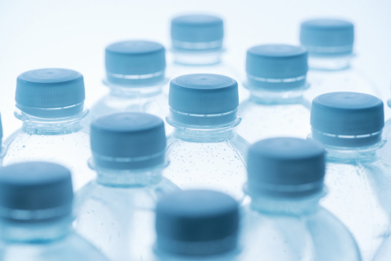 transparent bioplastic bottles and blue caps
