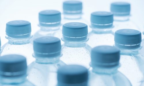 transparent bioplastic bottles and blue caps